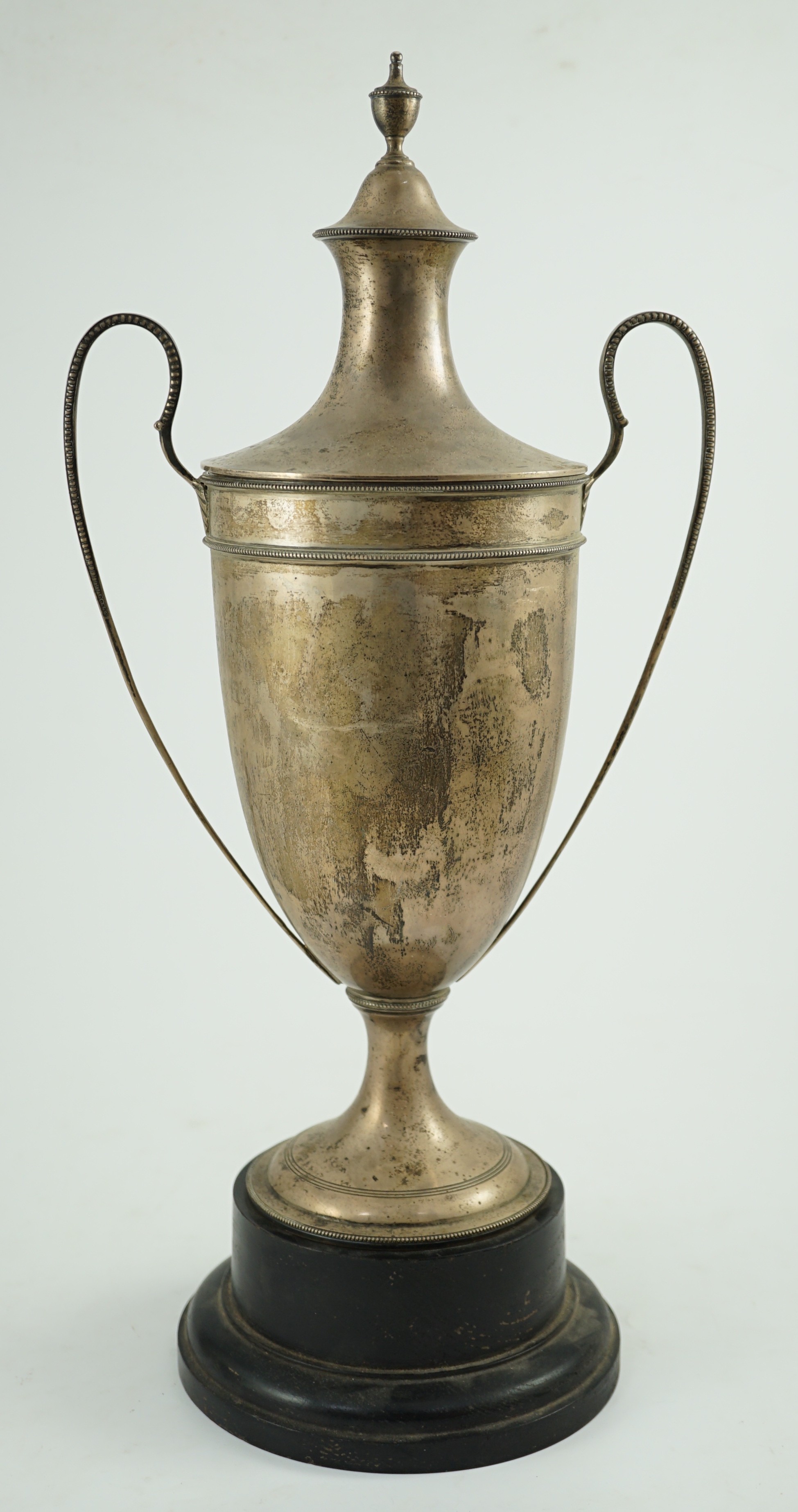 A George V silver two handled cup and cover by Sebastian Garrard